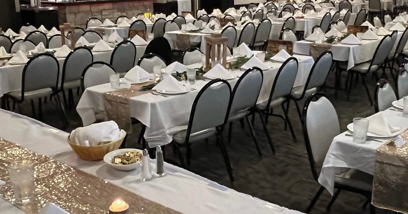 Interior, private dining area, square table for ten,  glasses, plates and utensils set