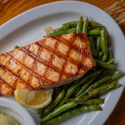 Grilled salmon, served, top view, closeup