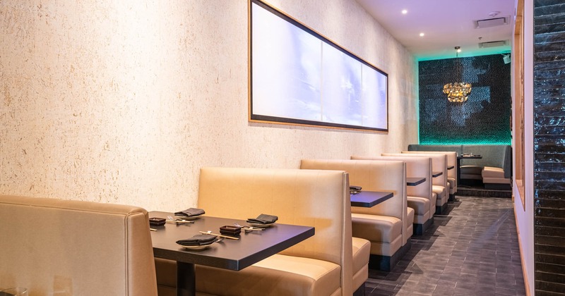 Interior, restaurant booths set for guests