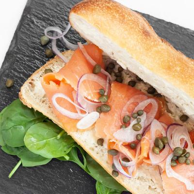 Smoked salmon sandwich, with butter, capers, and red onion.