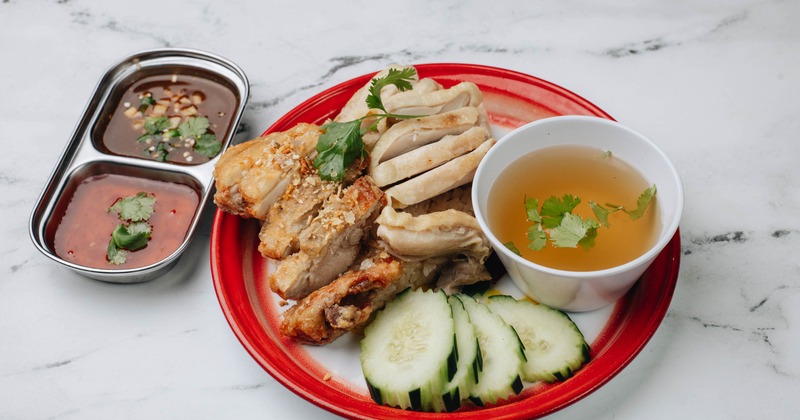 Thai Chicken Rice with chicken broth and dipping sauces on the side
