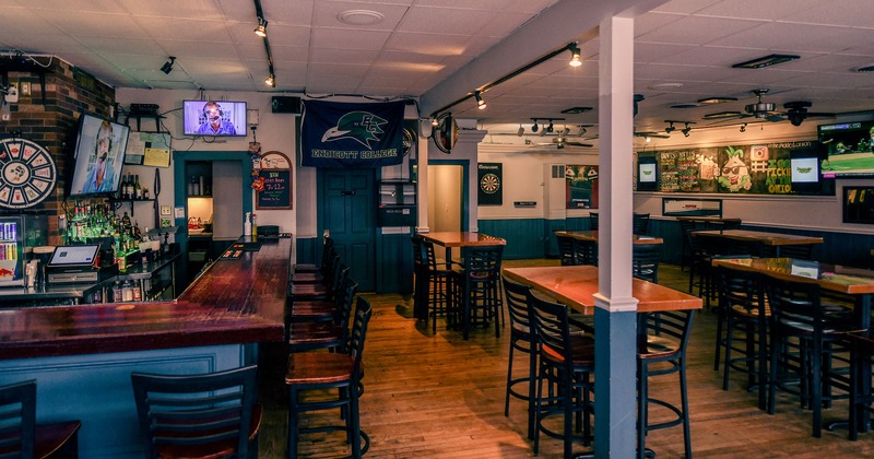 Bar area and seating area, TV screens on walls