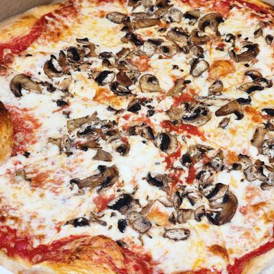 Pizza toped with cheese and mushrooms.