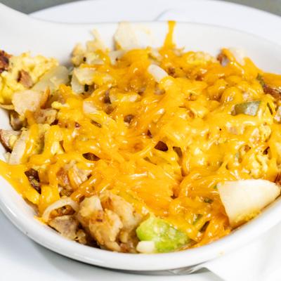 Mohegan Skillet with scrambled eggs, sausage, veggies, cheese and home fries.