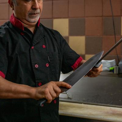 Chef sharpening knives.