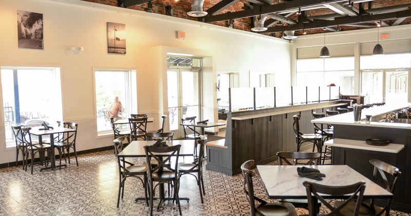 Interior, wide view, tables and chairs ready for guests