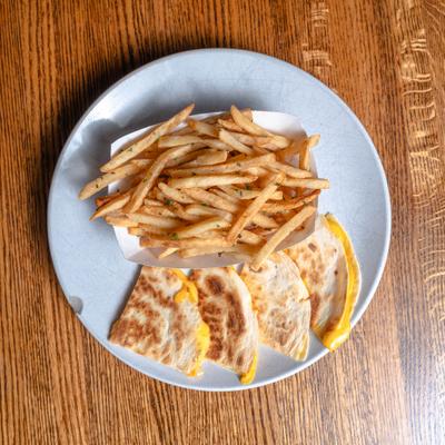 Cheese quesadilla with fries top view.