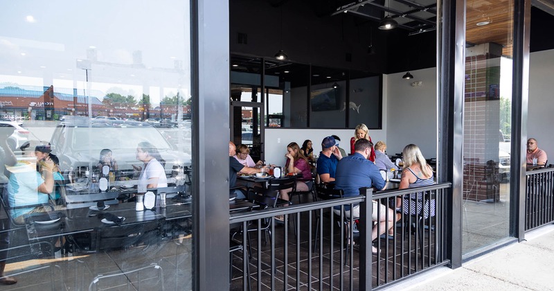 Interior, dining area with tables set for guests and decoration on the walls