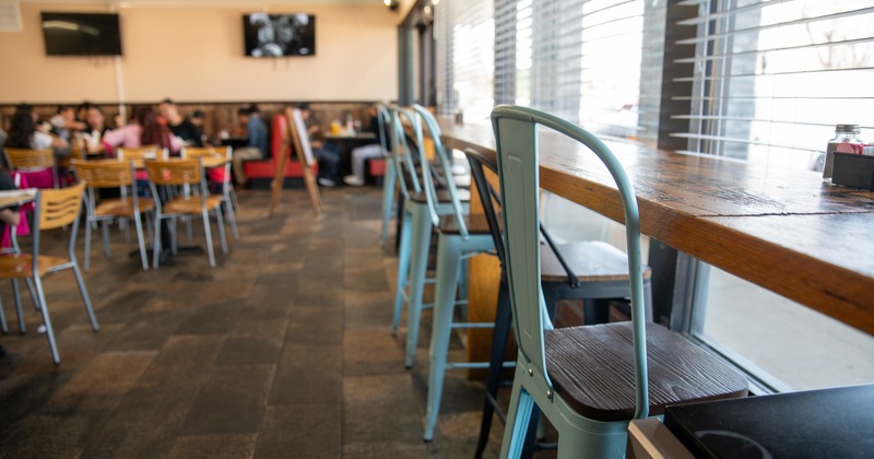 Diner bar table and chairs  in front, diner area behind
