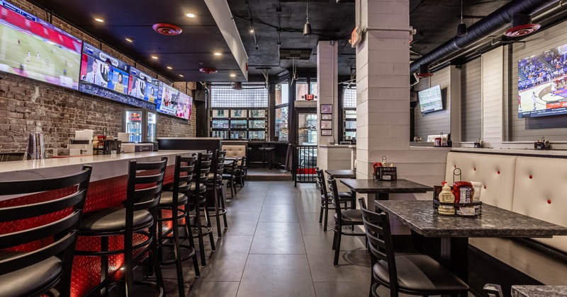 Interior, tables on the right side and bar on the left side