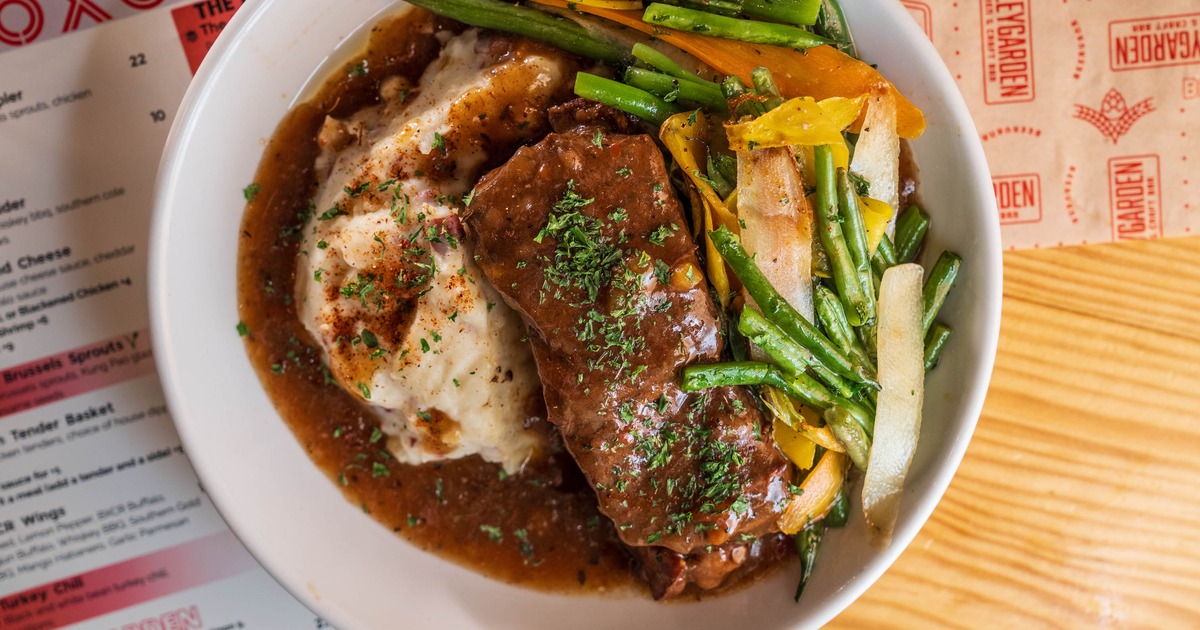 Braised Beef Short Rib served with mashed potatoes, gravy and vegetables