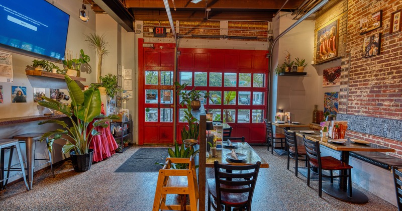 Interior, tables and chairs in dining area