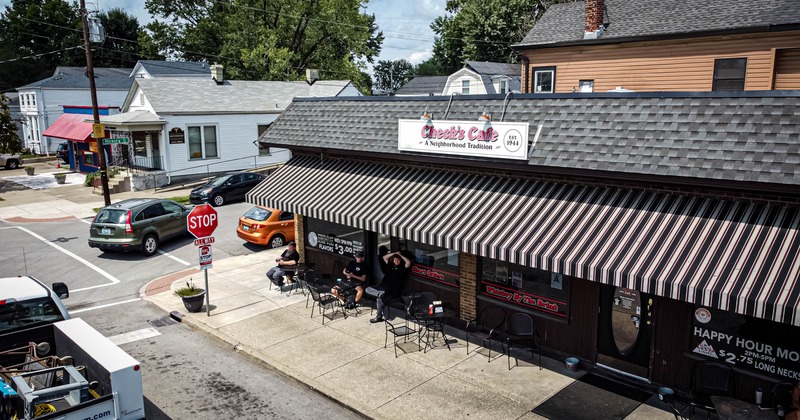 Exterior,  aerial photo of entrance,  awning, tables and chairs