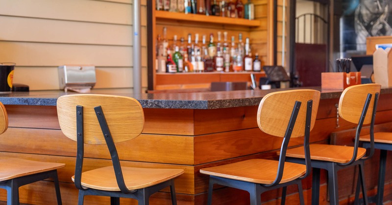 Bar area with wooden stools