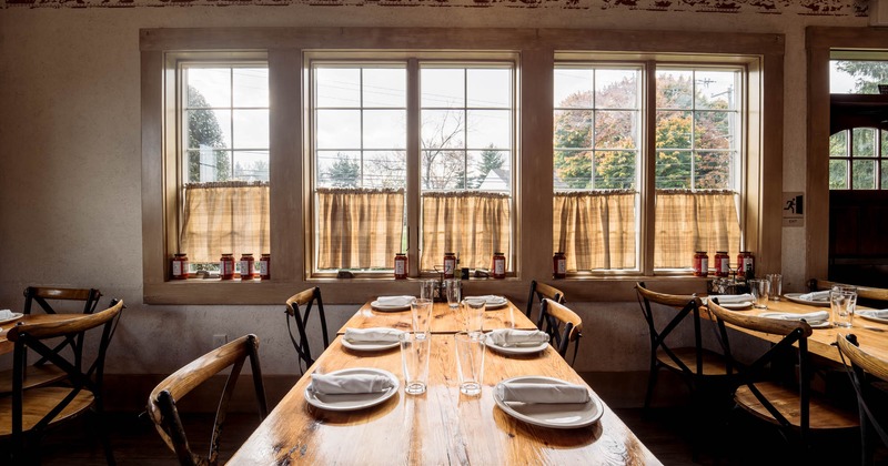 Interior,  tables and chairs by the window