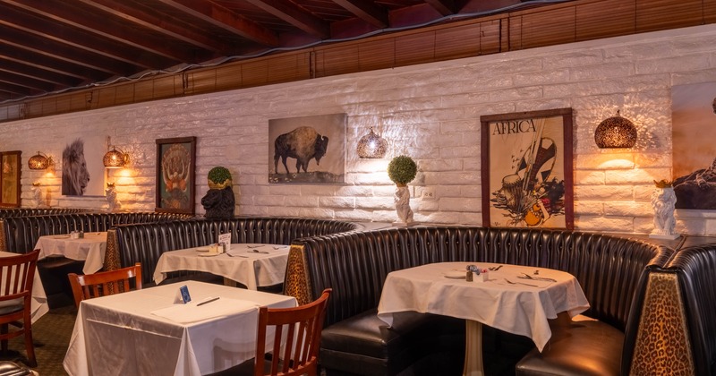Interior, dining area, ''U'' shaped seating booths with white cloth tables