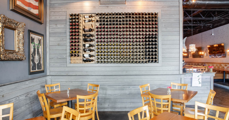 Interior, seating area by the wine shelves