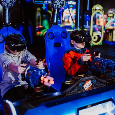2 kids playing a VR game.
