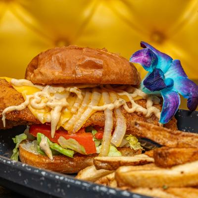 Fried catfish sandwich served with fries.