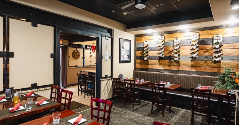 Wide view to the restaurant interior, tables and chairs, rooms