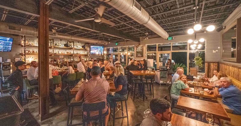 Interior, bar full of guests