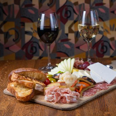 Charcuterie Board with two glasses of wine