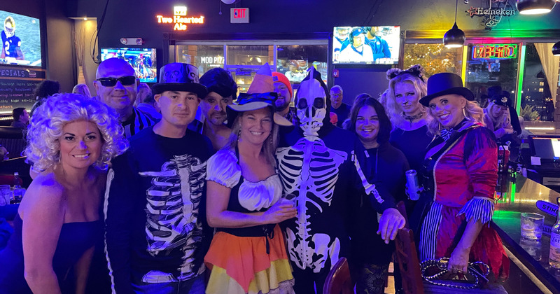 Interior, guests smiling and posing for the photo