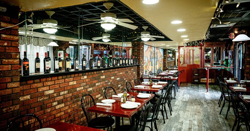 Restaurant interior, dining area with set tables