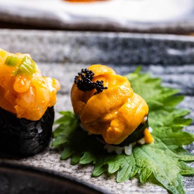 Sea urchin nigiri topped with black caviar.