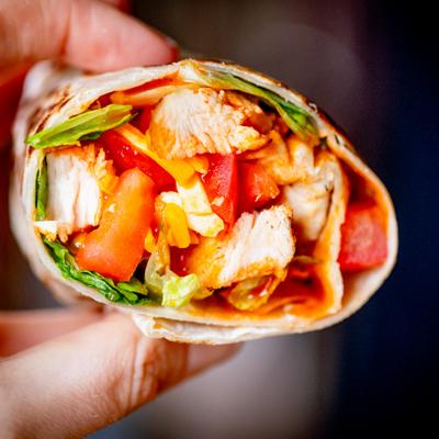 Chicken wrap filled with vegetables.