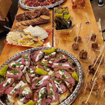 Assorted appetizer dishes on a wooden table.