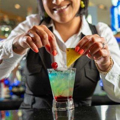 Bartender preparing a cocktail.