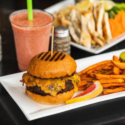 Cheeseburger with fries and strawberry smoothie.
