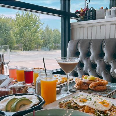 A table laden with an assortment of food dishes and drinks.