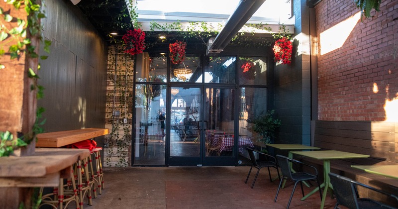 Exterior, seating area, high and regular seating, restaurant entrance