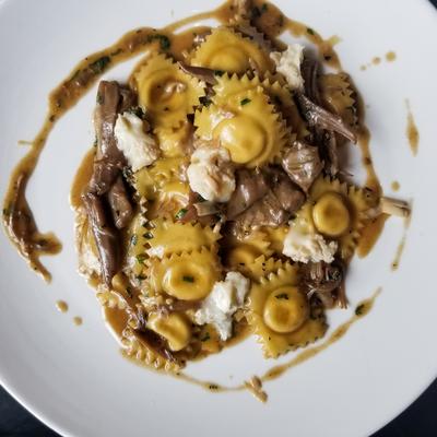 Ravioli with mushrooms and sauce.