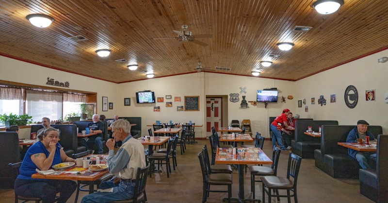 Interior, wide view, dining area, guests sitting