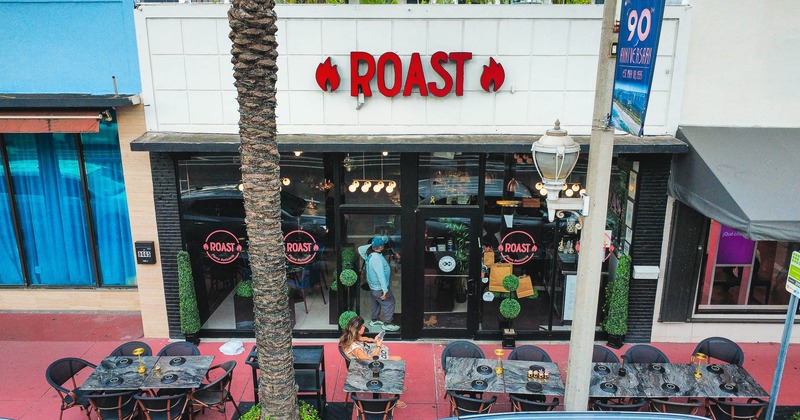 Exterior, tables and chairs ready for guests, near the entrance