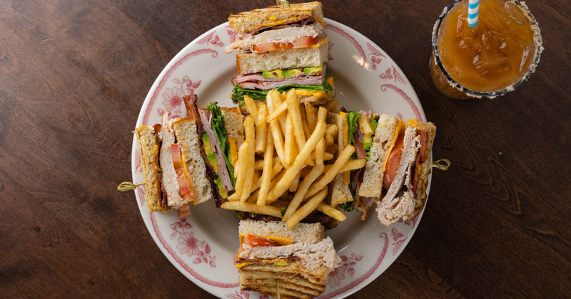 Four sandwiches, fries in the middle