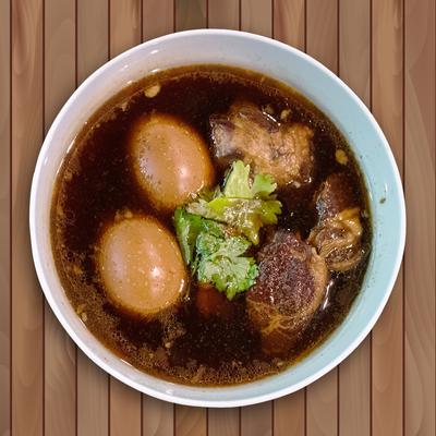 Slow-cooked pork, pork belly, and a boiled egg in broth.