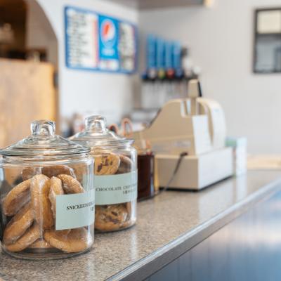 Cookie jars on a restaurant counter.