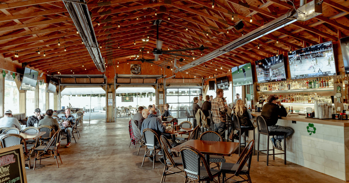 Interior, guests sitting, enjoying food and drinks