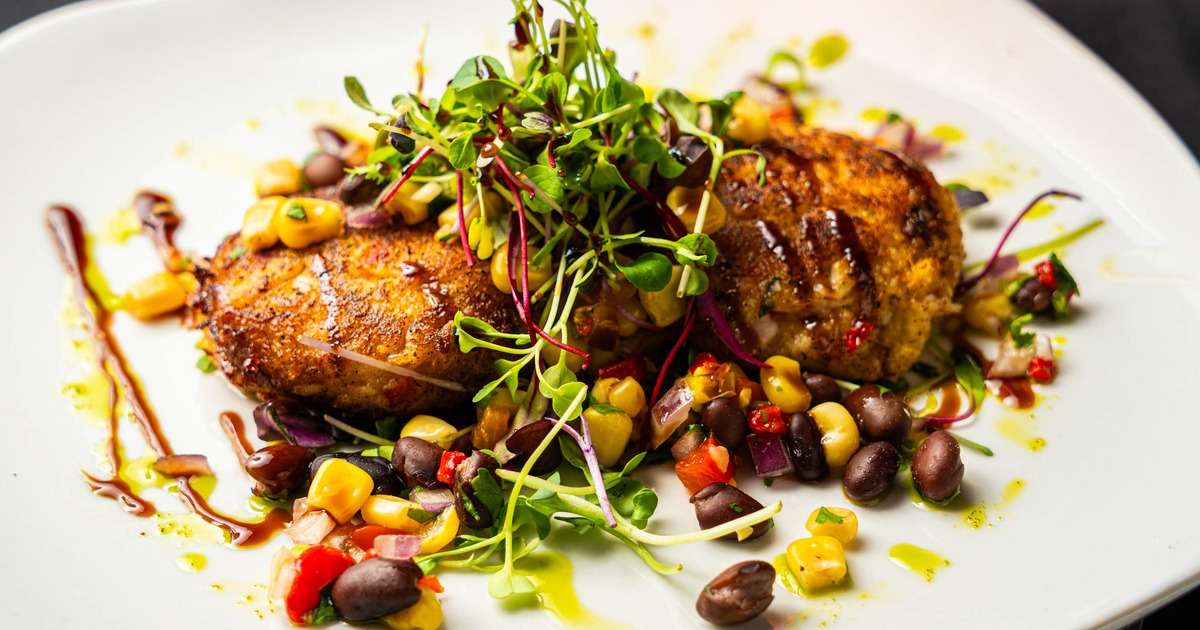 Crab cakes with microgreens and corn and black bean salsa