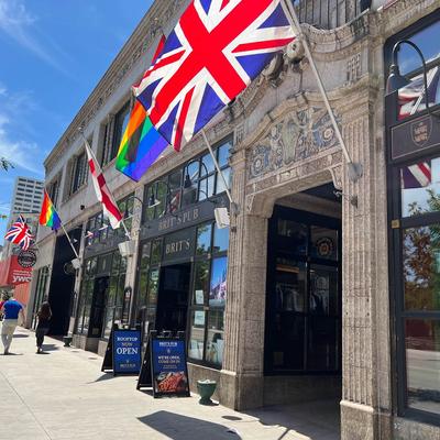Exterior, building, sidewalk, British flag.