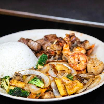 Hibachi steak, shrimp, and lobster, with grilled onions, mushrooms, broccoli, and rice.