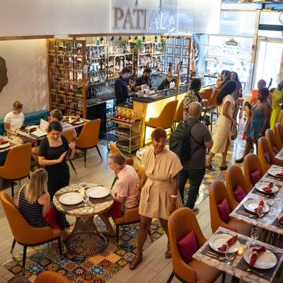 Crowded interior,  dining area.
