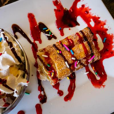 Casa Bravos Cheesecake, served with ice cream.