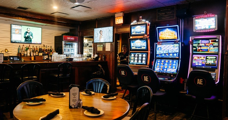 Interior, round dining table, slot machines