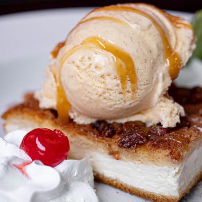 Sopapilla Cheesecake topped with with cinnamon sugar ice cream