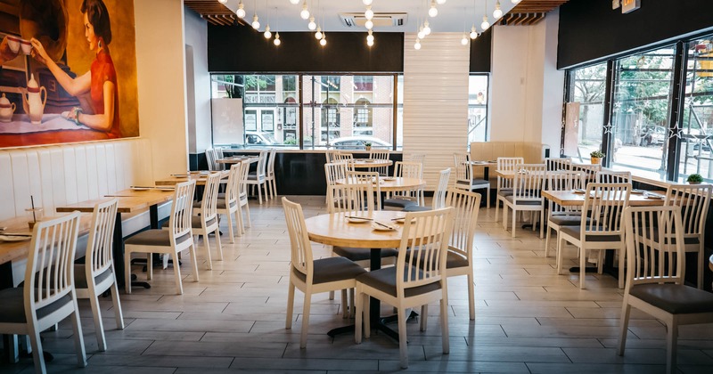 Interior, big dining area with a big mural on the wall
